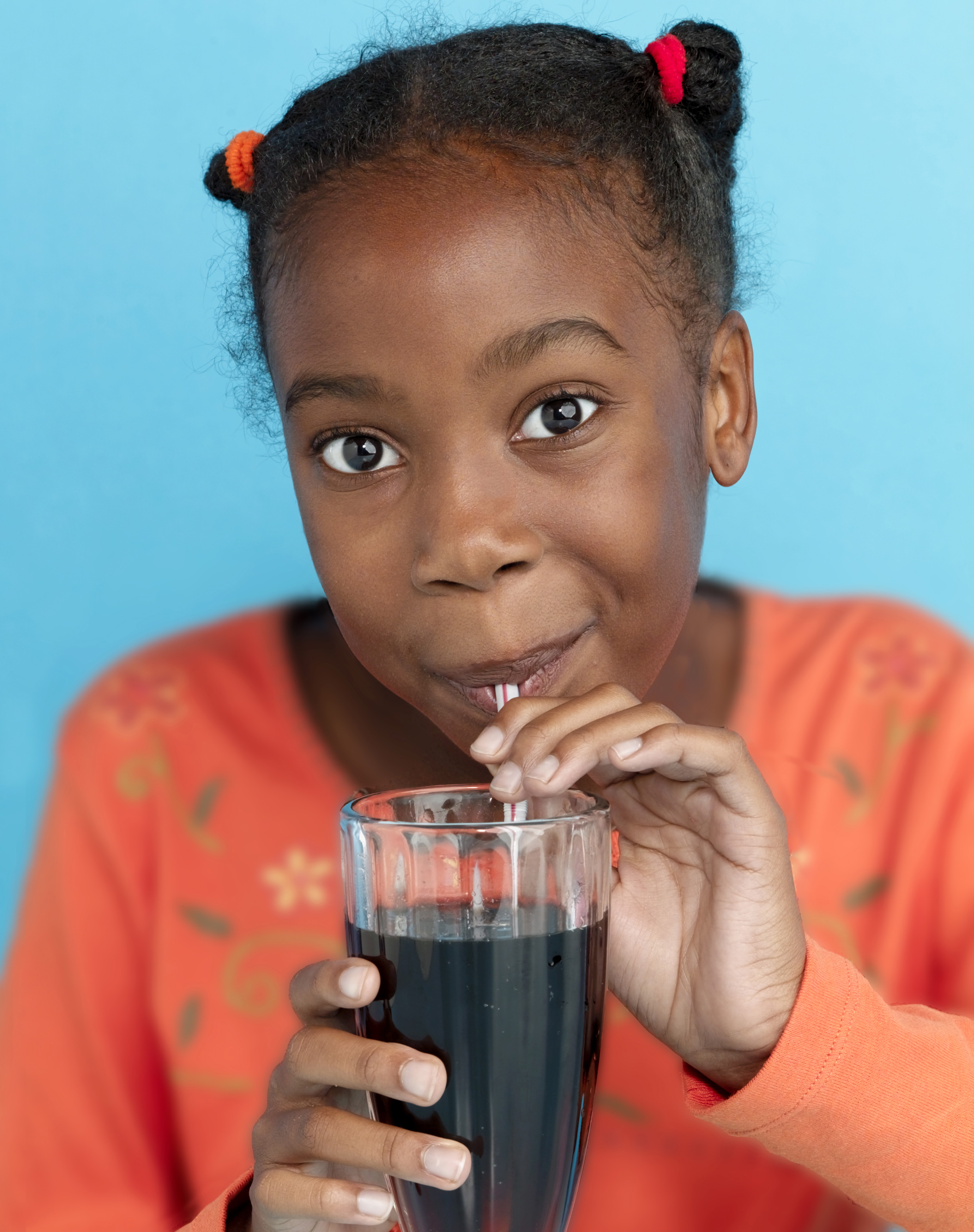 girl drinking root beer with straw