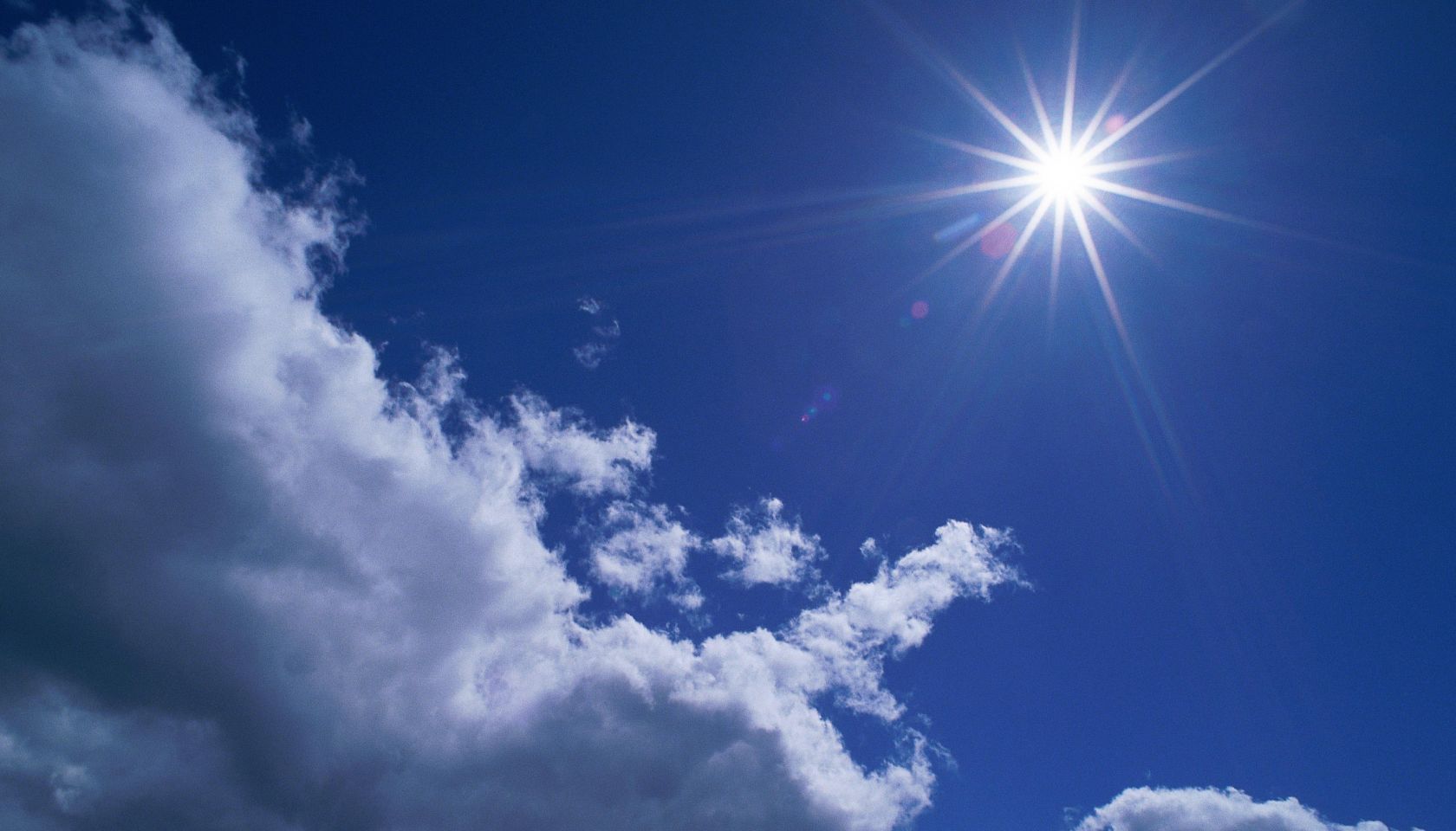 Scattered cumulus clouds and bright sun