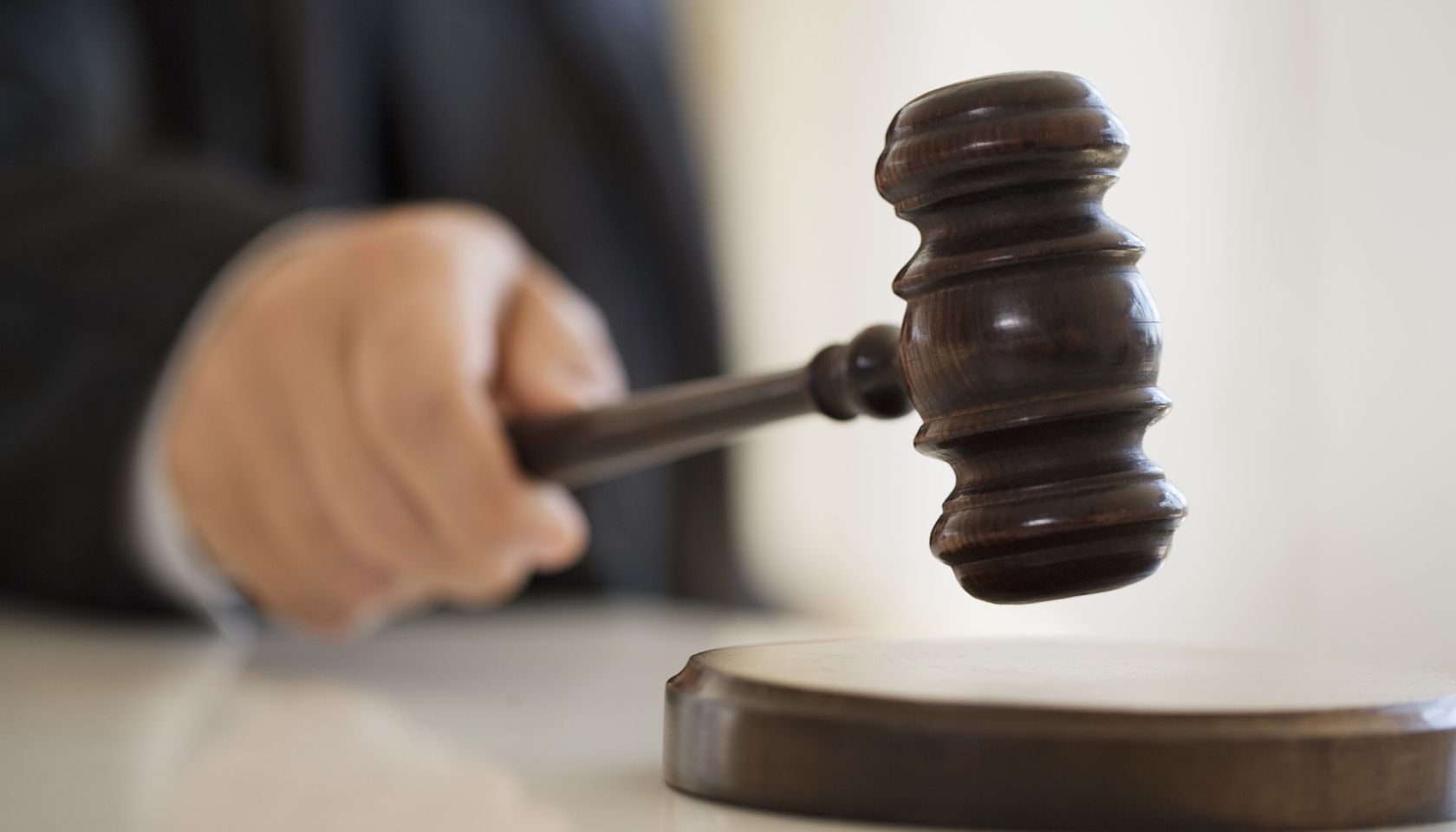 Judge holding gavel, close-up