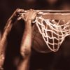 Basketball player dunking ball, close-up (toned B&W)(Composite)