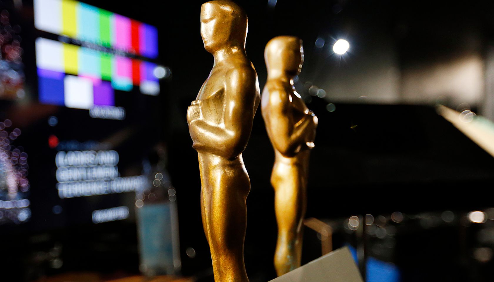 LOS ANGELES, CA - FEBRUARY 18, 2015: Two wooden stand-in Oscar statuettes are ready to be taken on