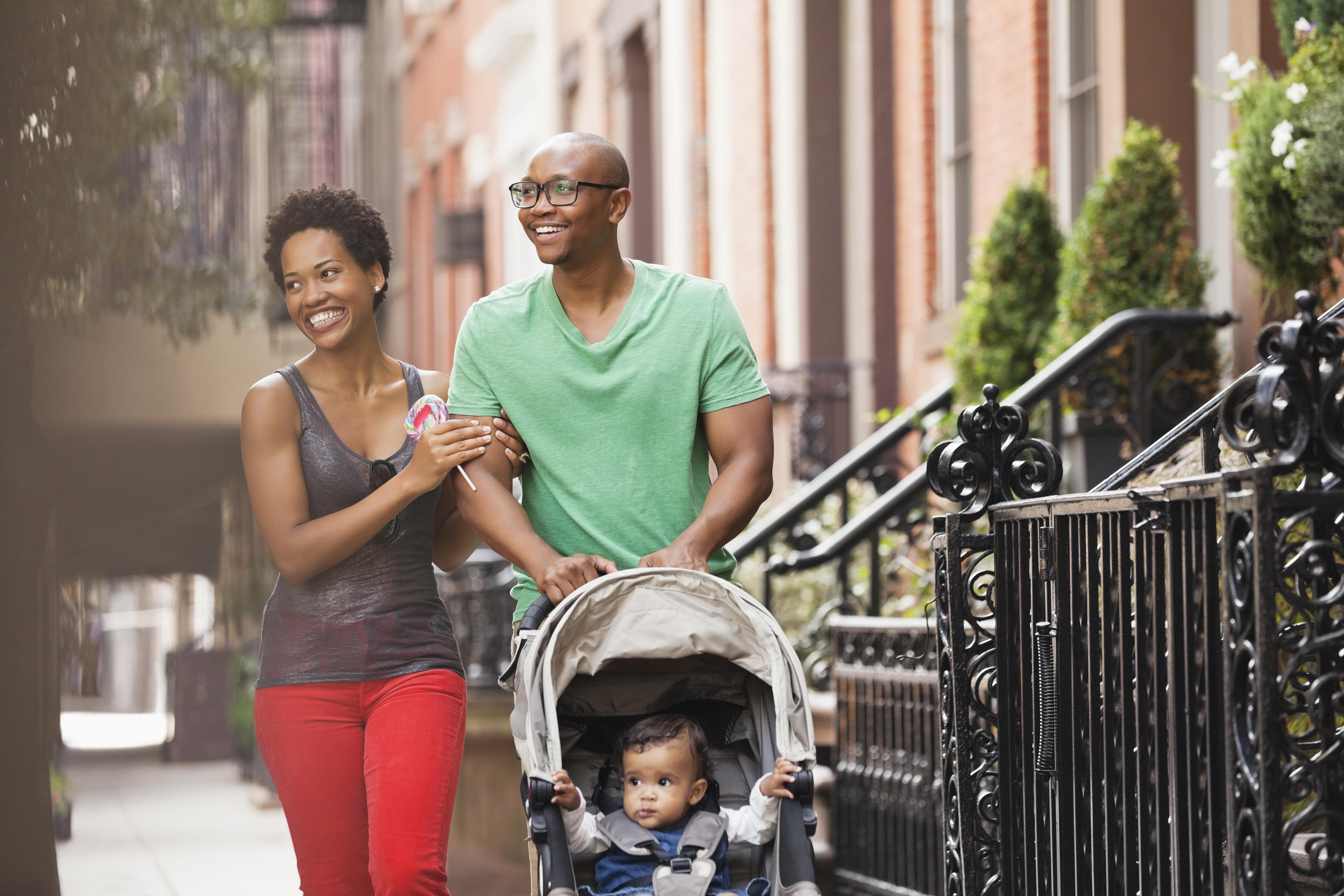 Family walking together on city street