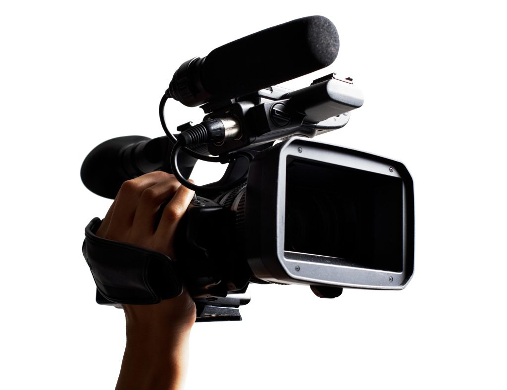 Hand holding HD broadcast camcorder.