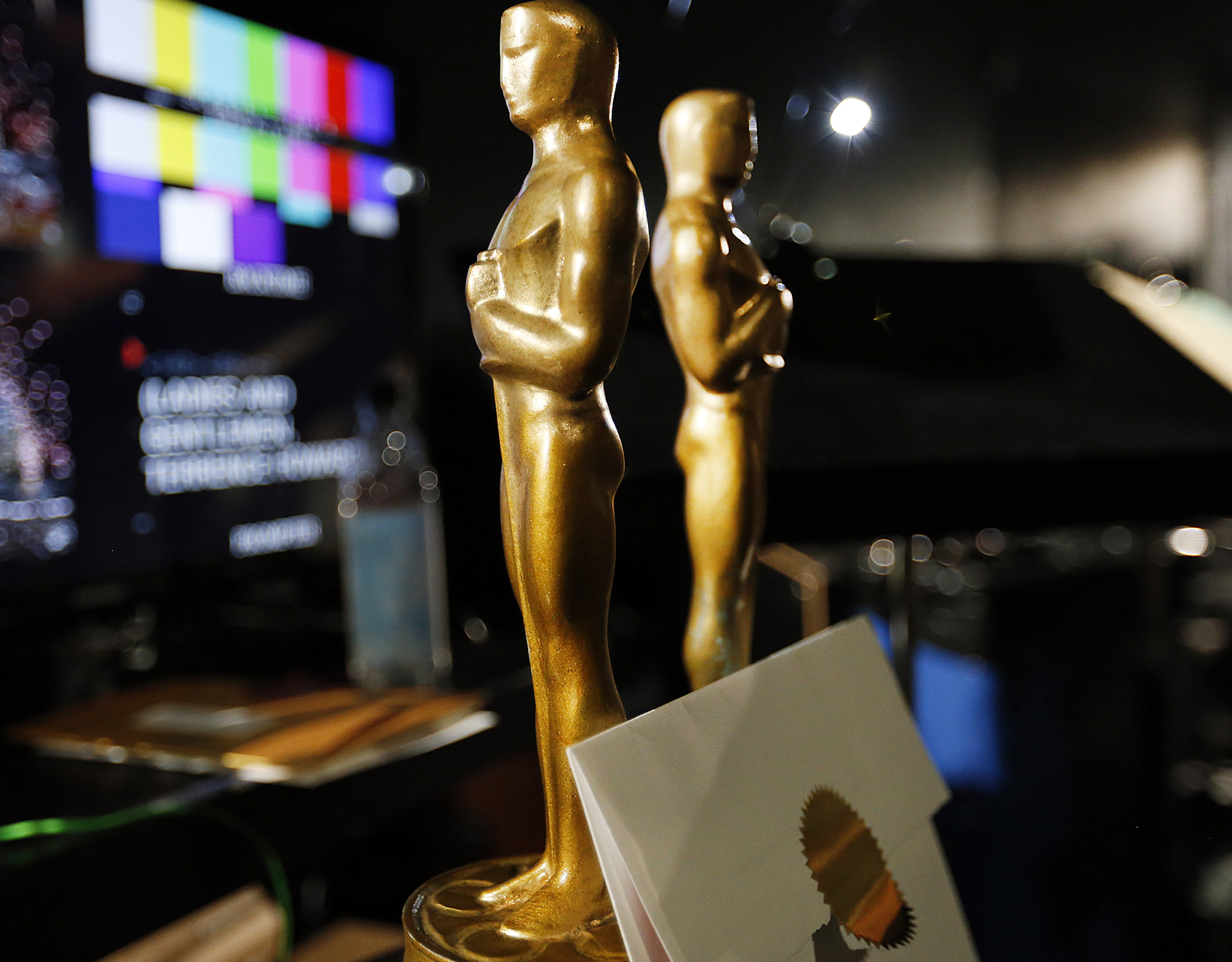 LOS ANGELES, CA - FEBRUARY 18, 2015: Two wooden stand-in Oscar statuettes are ready to be taken on