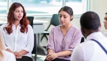 Upset woman attends support group meeting