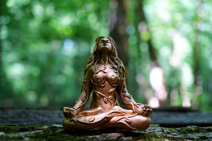A statue of Buddha in a female form.