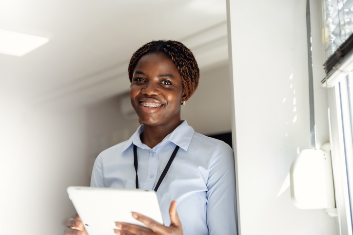 Successful young black Woman with tablet