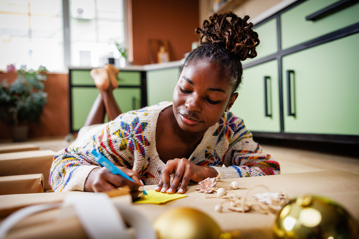 Beautiful Young Lady Handwriting on Gift Card for Christmas