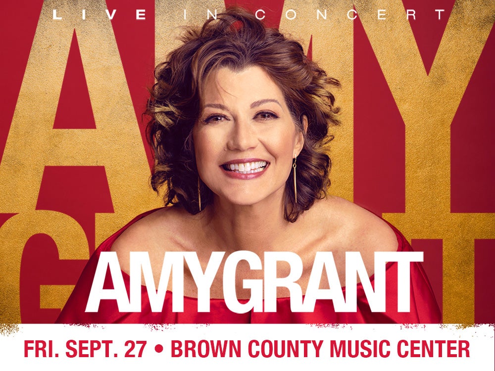 Smiling portrait of Amy Grant, a popular American singer-songwriter, against a red and gold background with text "LIVE IN CONCERT" and "AMY GRANT" at the Brown County Music Center.